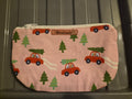 Handmade pink makeup bag with red cars carrying Christmas trees pattern