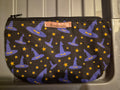 Handmade black makeup bag with purple witch hats and gold stars pattern