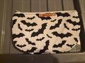 Handmade makeup bag with black bats on white fabric pattern