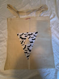 Handmade canvas tote bag with black and white bat print triangle pennant appliqué